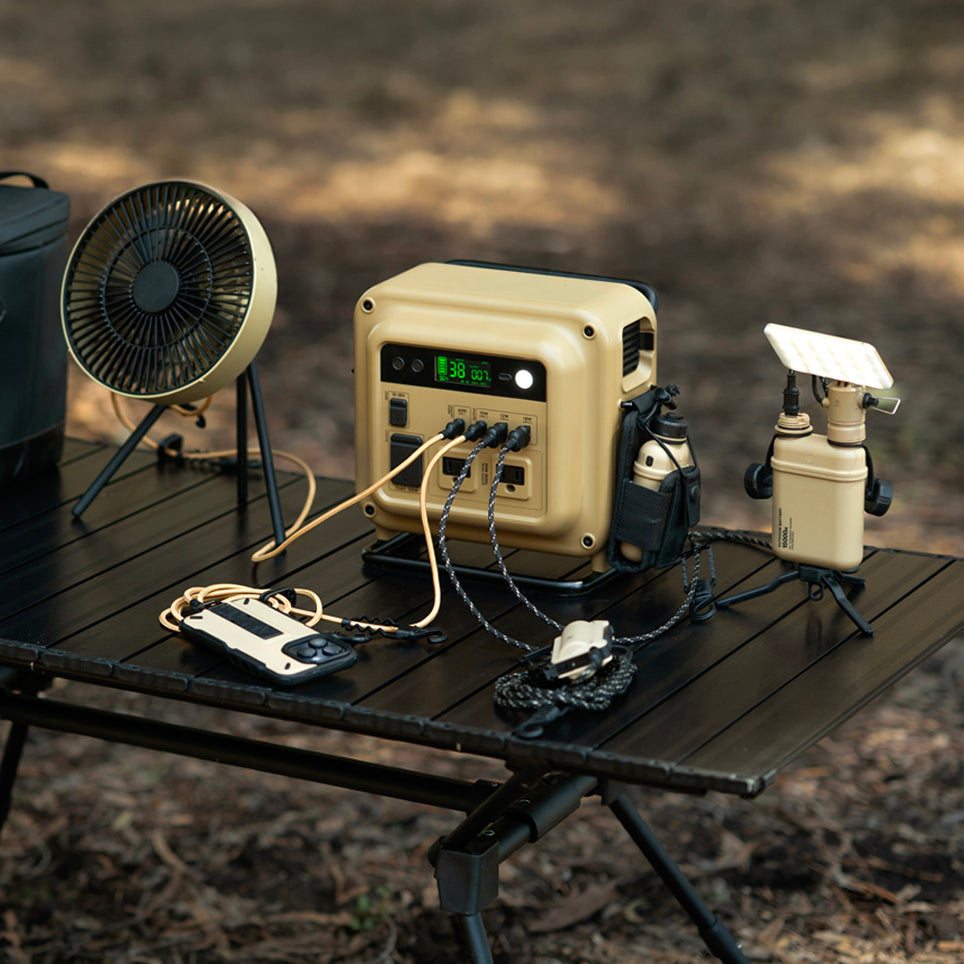 Power station with nestout 15k battery, phone, and fan plugged in