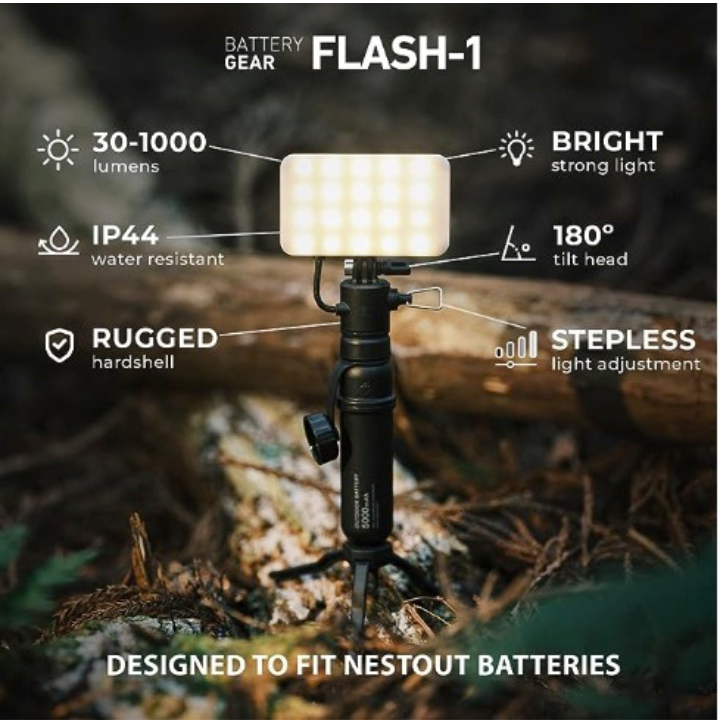 NESTOUT flashlight accessory in use with rugged portable battery on tripod | graphic reads: battery gear flash-1, 30-1000 lumens, BRIGHT strong light, IP44 water resistant, 180 degrees tilt head, RUGGED hardshell, STEPLESS light adjustment