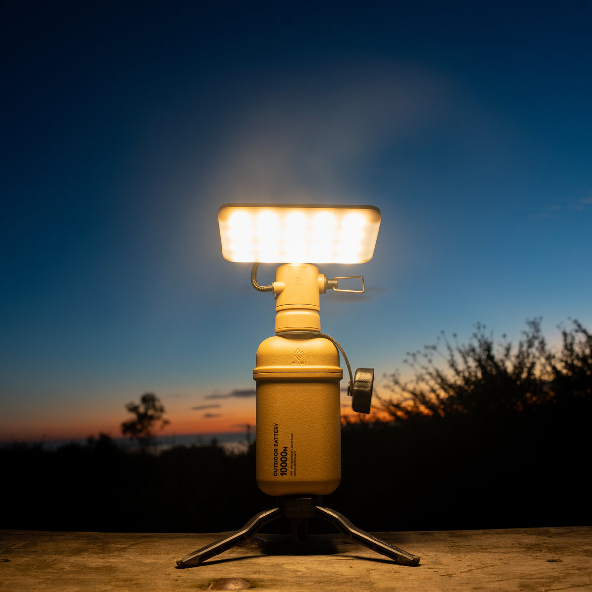Outdoor 10k power bank on a tripod with flash attachment outdoors 