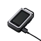 Black and gray CO monitor device with a USB cable connected on a white background