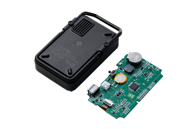 Electronic component with a black casing and green circuit board on a white background
