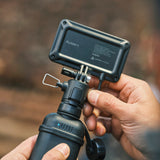 Image of the back of the nestout black flash connected to the 10k black battery turned showing charge indicator