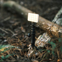 Image of the nestout black flash connected to the 5k black battery turned on in the woods