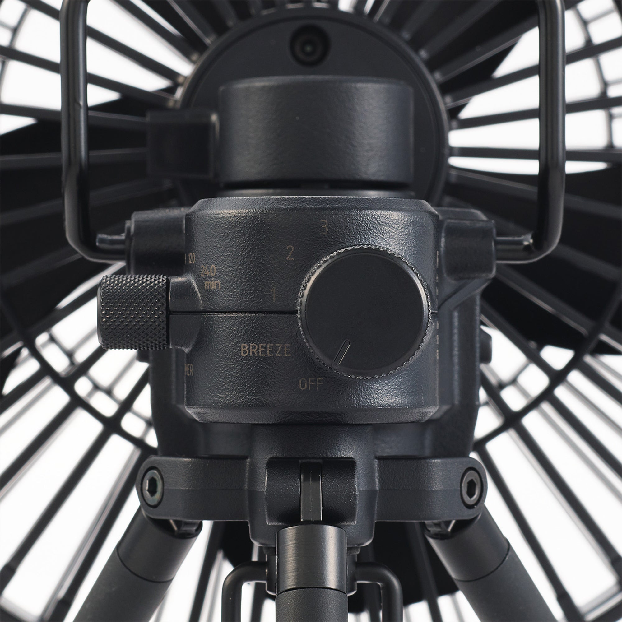 image of breeze knob of nestout black fan with black tripod attached
