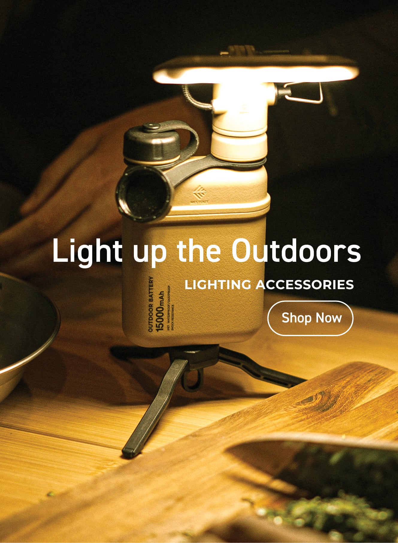 light up the outdoors - NESTOUT lighting accessories custom fit to be used with any nestout outdoor and remain water resistant - image of the flash-1 attached to a beige 15K power bank lighting a camping meal prep station battery