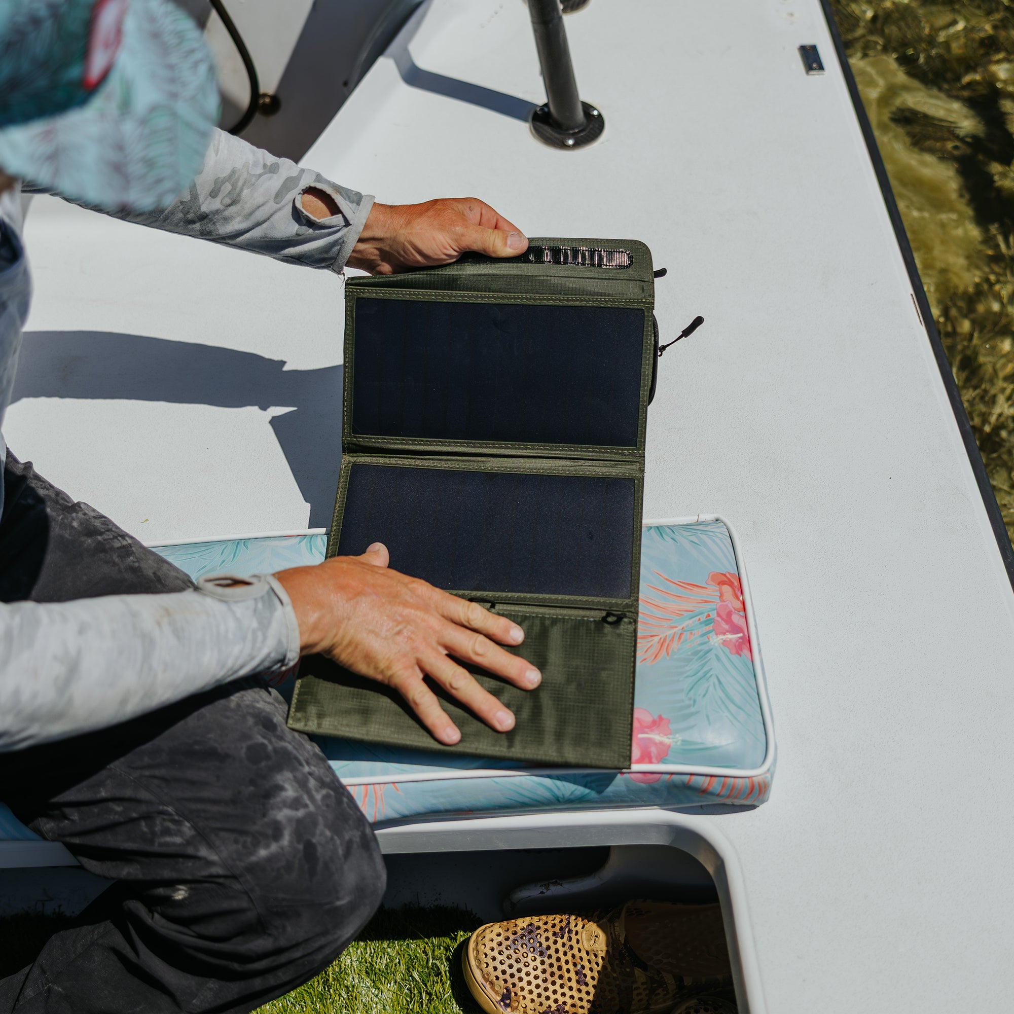 image of fisherman opening the nestout olive green 4 solar panel