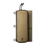 Folded up beige solar panel showcasing zippers and loops on a white background