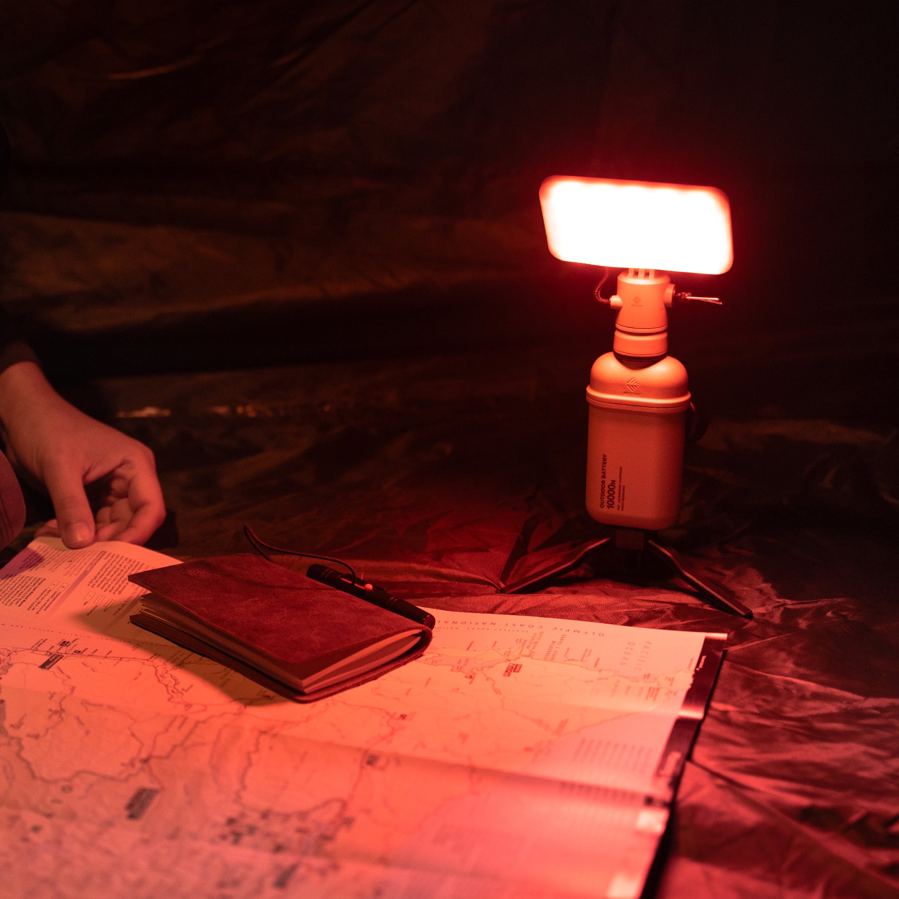 10k power bank with flash-1 attachment and a red filter attached to it