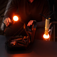 two 5k power banks with lamp attachments and a red and orange filter attached
