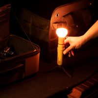 5k power bank with lamp attachment that has an orange filter on it