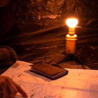 10k power bank with a light attachment that has an orange filter on it
