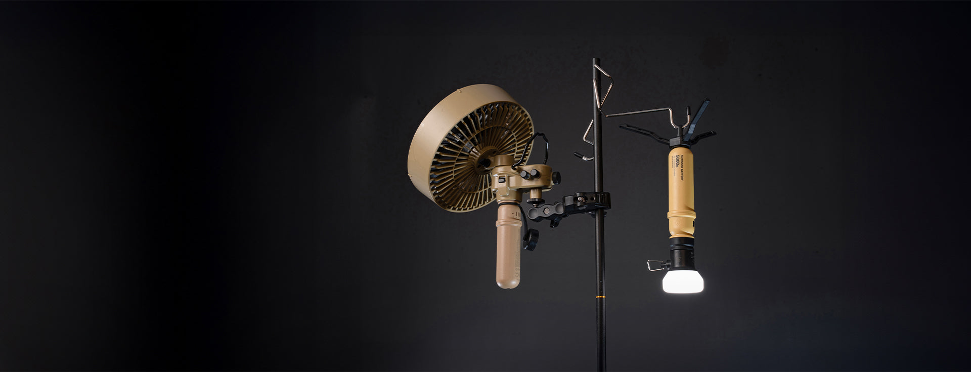 Nestout 5000mah batteries mounted to a light holder with a clamp and hook against a black background