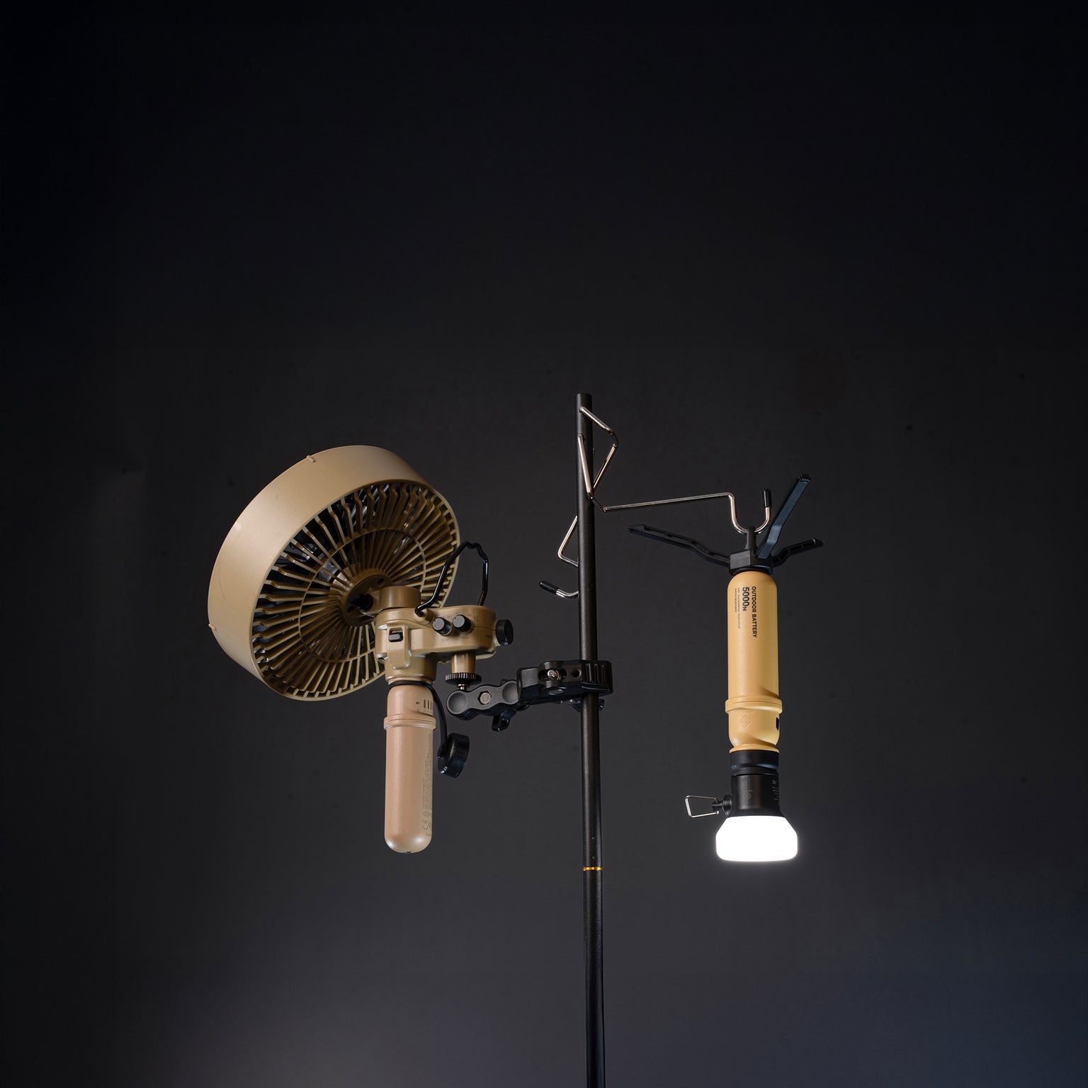 Nestout 5000mah batteries mounted to a light holder with a clamp and hook against a black background