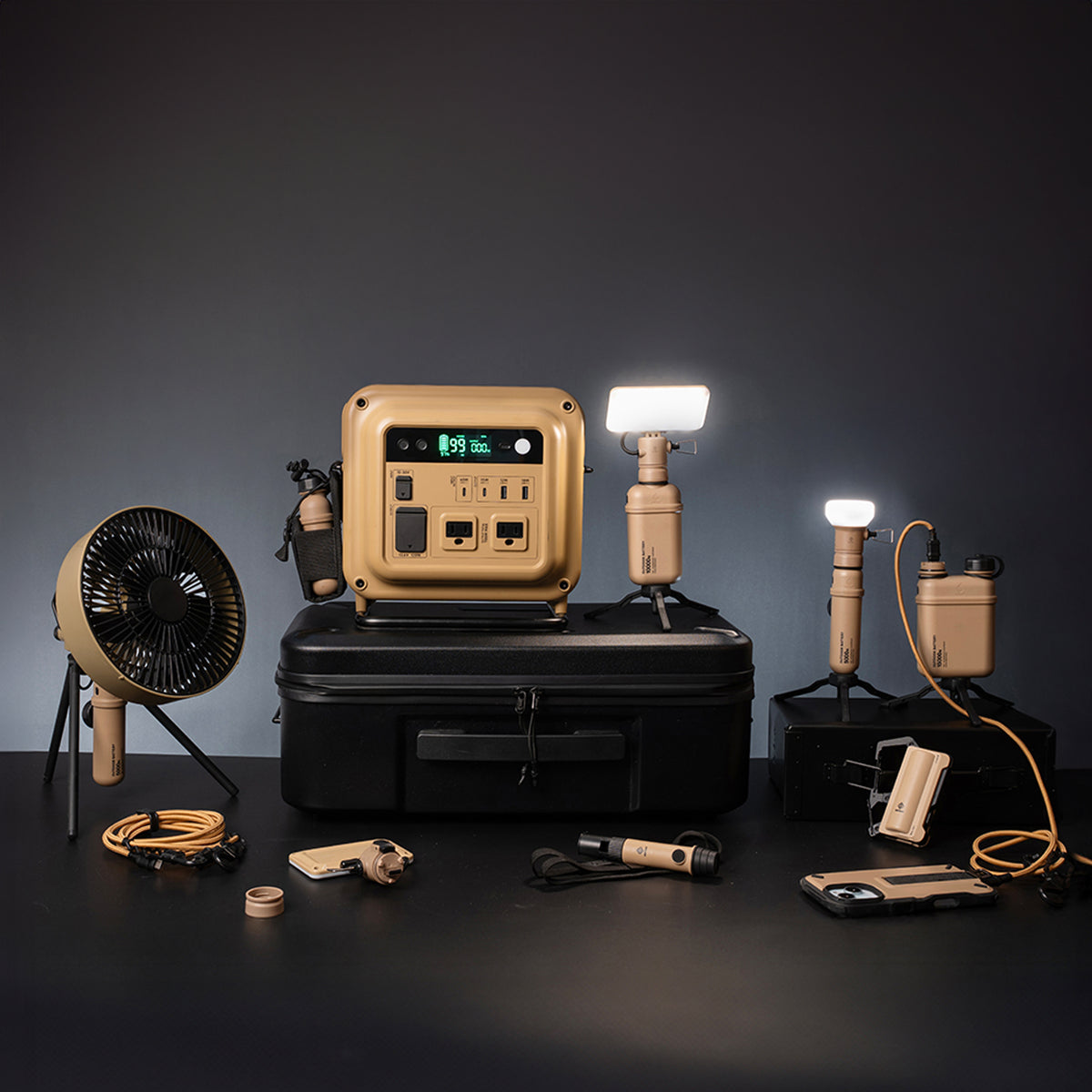 Collection of outdoor NESTOUT gear including a power station, power banks, lights, and fan on a dark background.