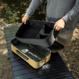 large beige gear case featuring a person holding the inner lining foam divider