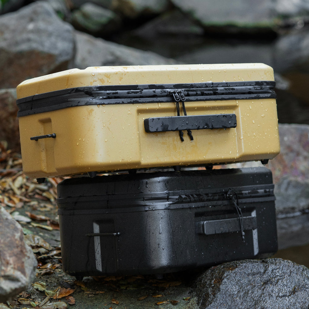 gear cases with water droplets on the outside of case stacked on water