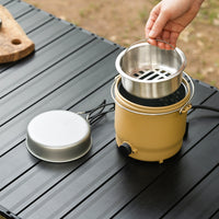 Outdoor cooker showing its inside metal compartment components outside