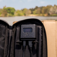 Digital meter within the beige solar panel used to monitor charging performance