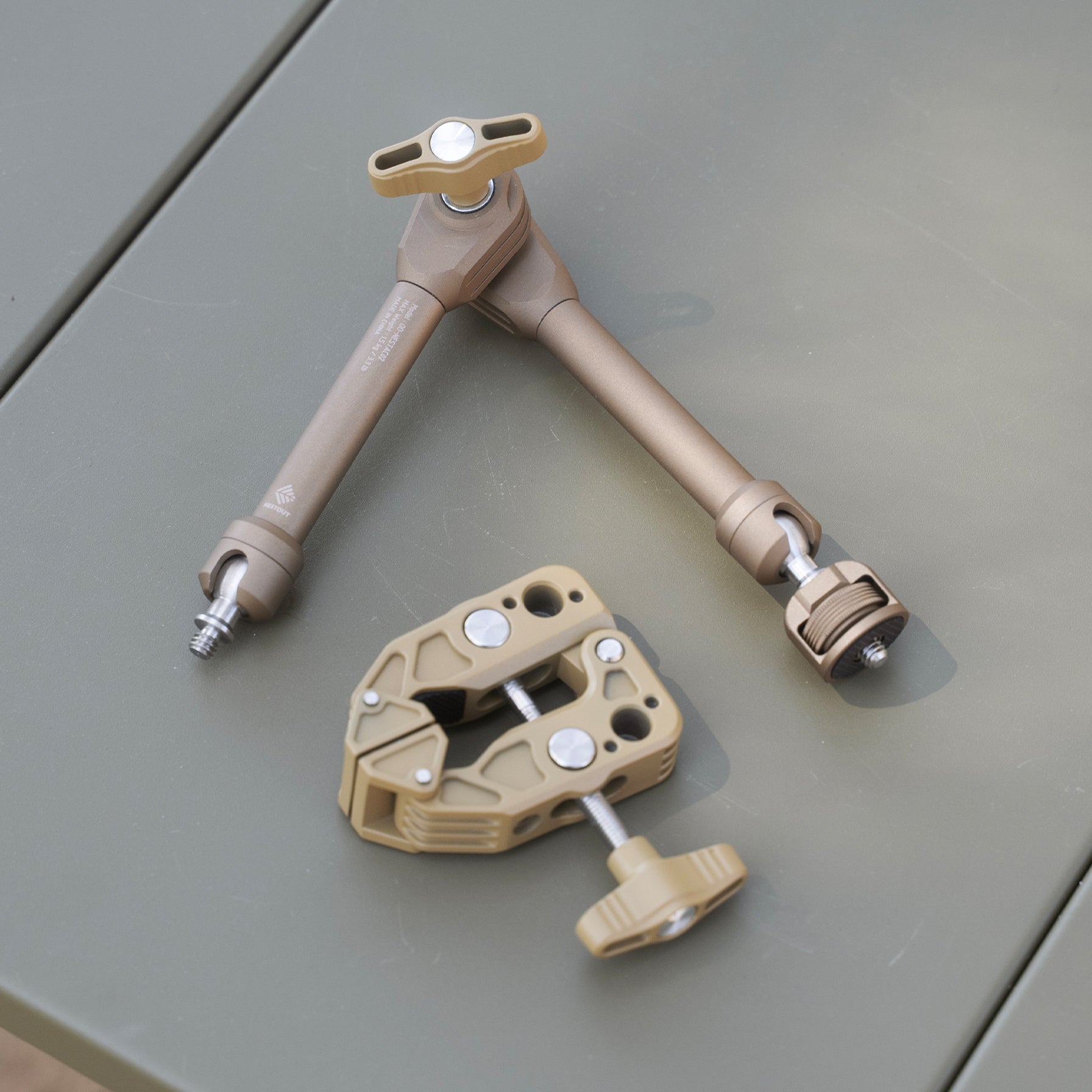 Displaying the two components of the beige clamp arm which include the adjustable arm and clamp