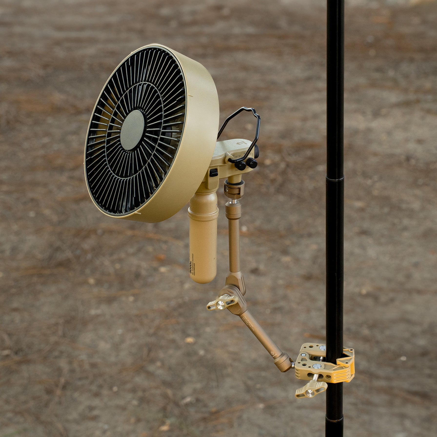Beige clamp arm attached to a black pole with an attached 5k power bank and fan