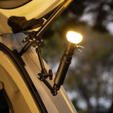 Black clamp arm attached to a car trunk pole with a 5k battery attached with a lamp on it
