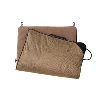 A beige heating pad partially folded over to show both sides, with brown fleece on one side and a topographic contour pattern on the other, shown on a plain white background.