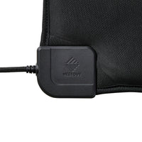 A close-up of the heating pad's corner cable connector with an embossed NESTOUT logo, attached to the black heating unit and shown on a white background.