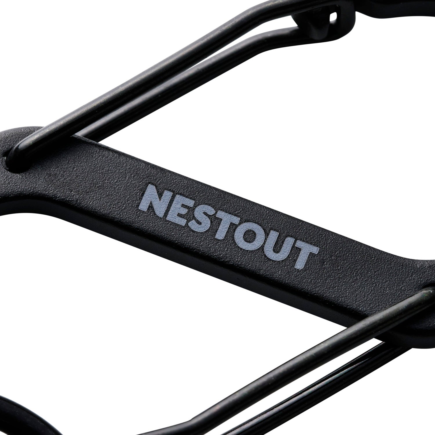 close up of the black battery mount carabiner with the nestout logo being shown