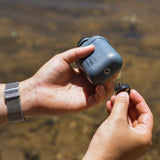 Image of bottom screw thread of nestout 10k grey colored cylinder battery pack with military IP67 rating | stores up to 10000N of power | rugged waterproof design | compact size | versatile charging | to be used with NESTOUT solar panels, fans, lamps, and flashes