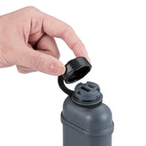 image of hand opening cap of nestout grey colored cylinder battery pack with military IP67 rating | stores up to 10000N of power | rugged waterproof design | compact size | versatile charging | to be used with NESTOUT solar panels, fans, lamps, and flashes