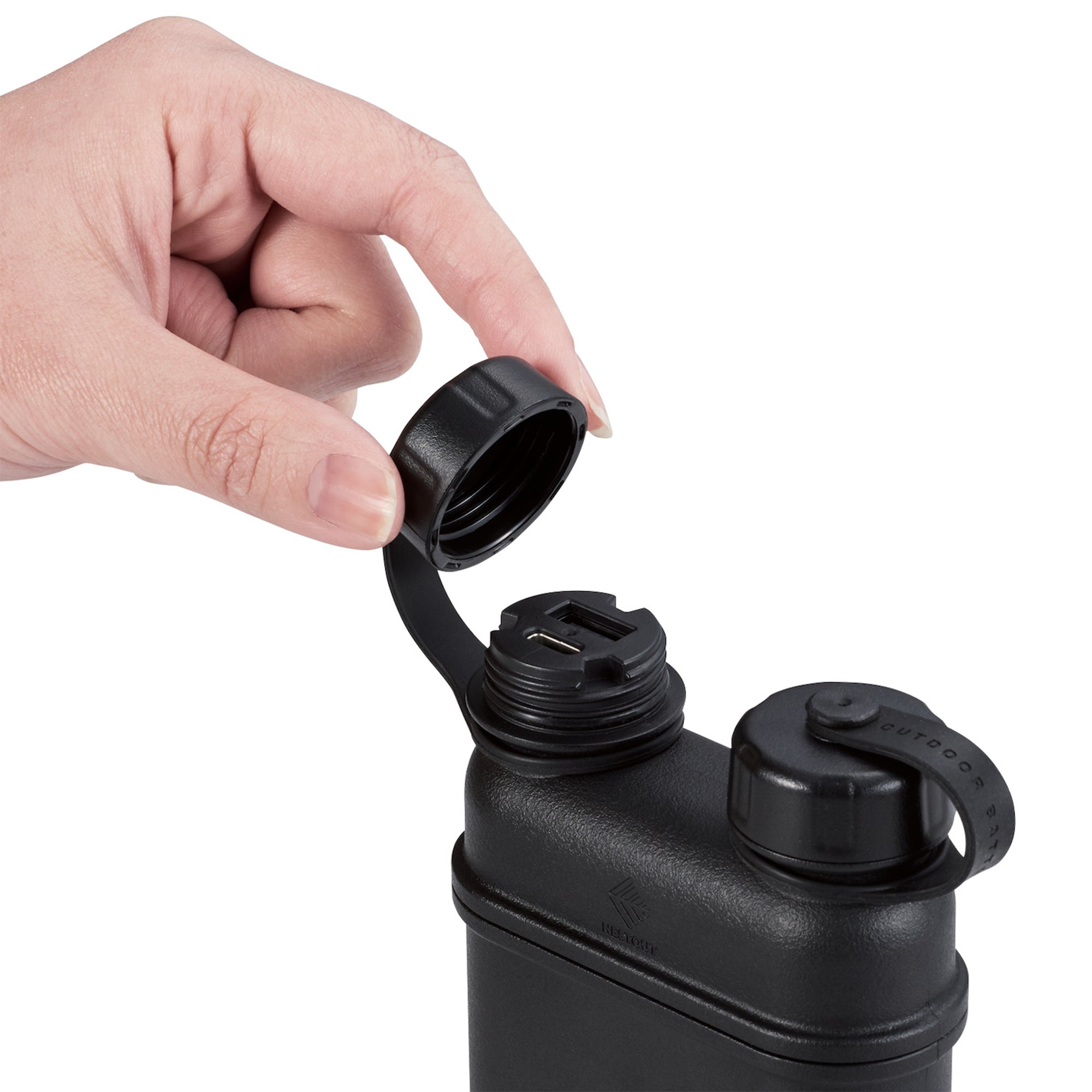 image of hand opening cap of nestout 15k black colored cylinder battery pack with military IP67 rating | stores up to 15000N of power | rugged waterproof design | compact size | versatile charging | to be used with NESTOUT solar panels, fans, lamps, and flashes