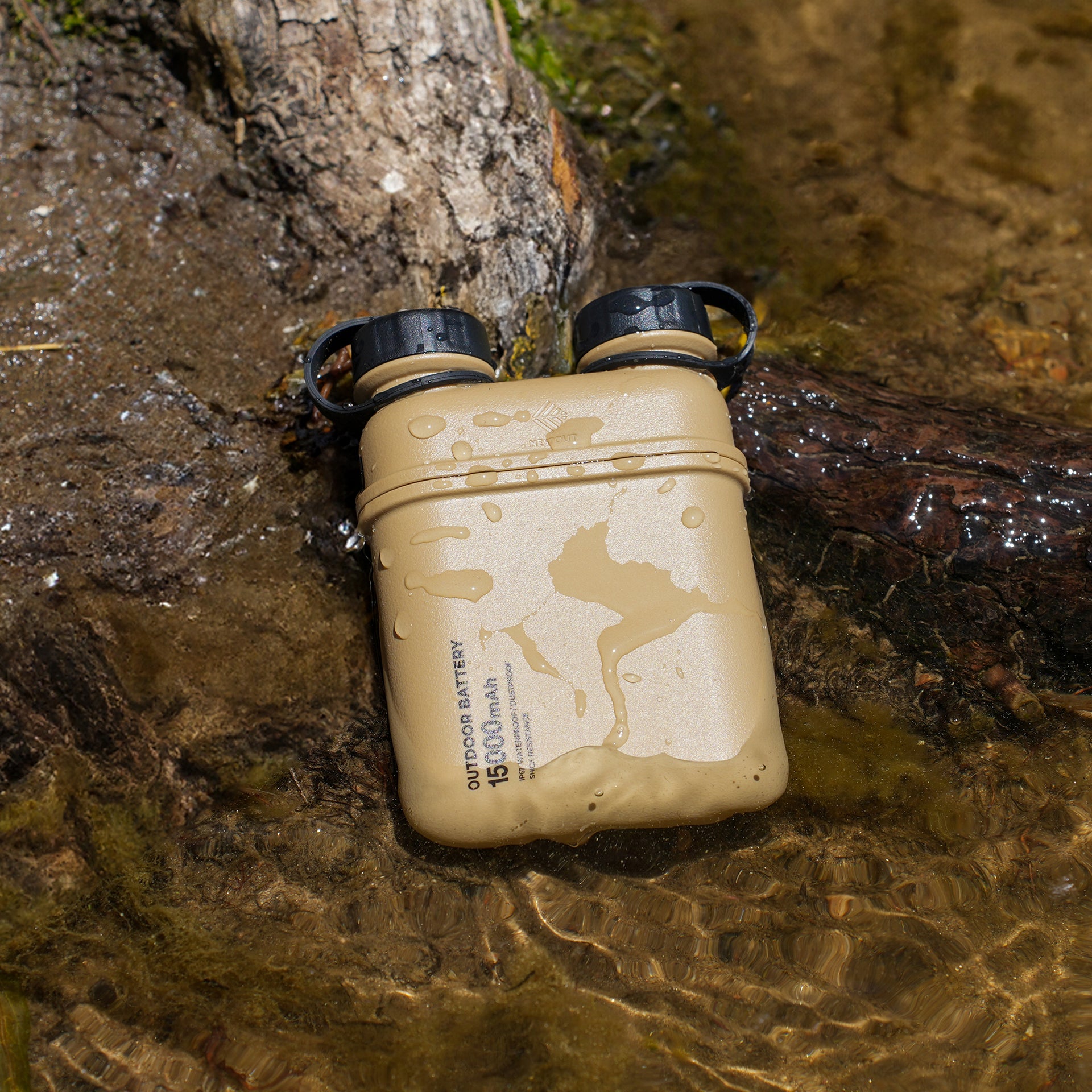 Image of wet nestout 15k beige colored cylinder battery pack with military IP67 rating | stores up to 15000N of power | rugged waterproof design | compact size | versatile charging | to be used with NESTOUT solar panels, fans, lamps, and flashes